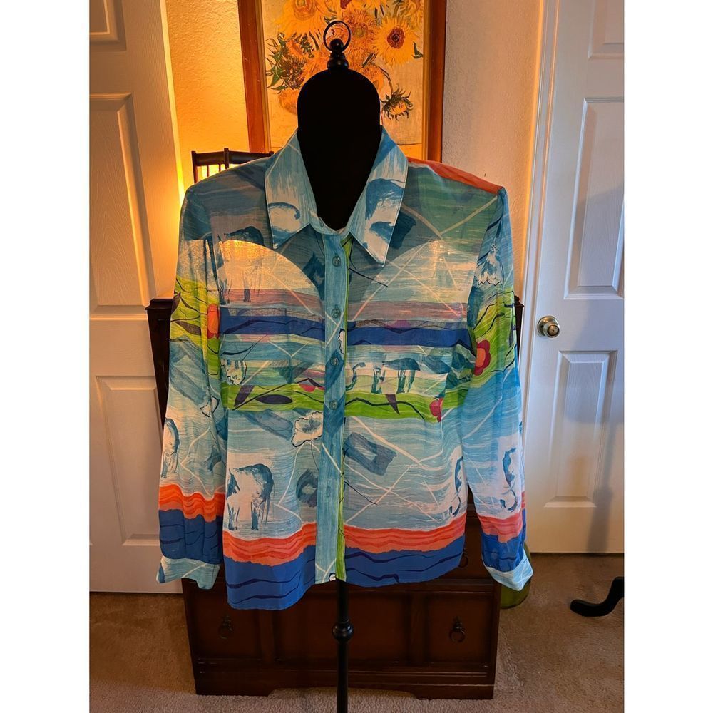 Colorful long sleeve vintage 80’s blouse with shoulder pads.
